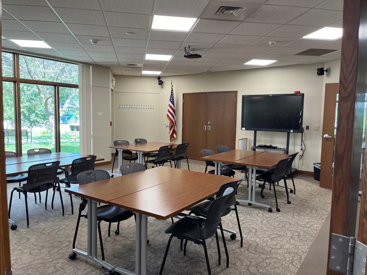 Room with tables set up in pods